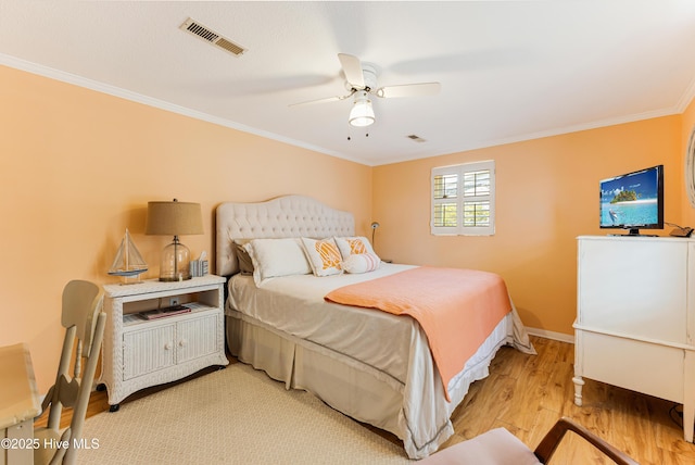 404 Mercer St, Oak Island, NC 28465 - bedroom featuring ornamental molding, light wood-type flooring, and ceiling fan
