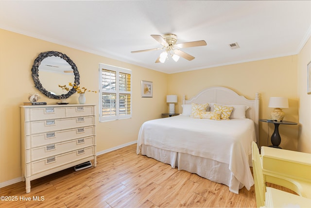 404 Mercer St, Oak Island, NC 28465 - bedroom featuring light wood finished floors, ornamental molding, and a ceiling fan