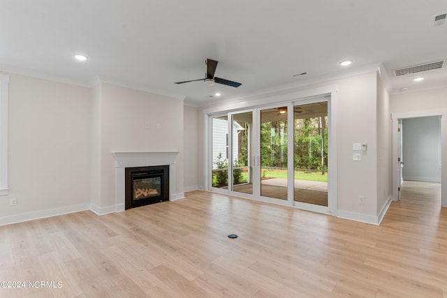 unfurnished living room with crown molding, ceiling fan, and light wood-type flooring