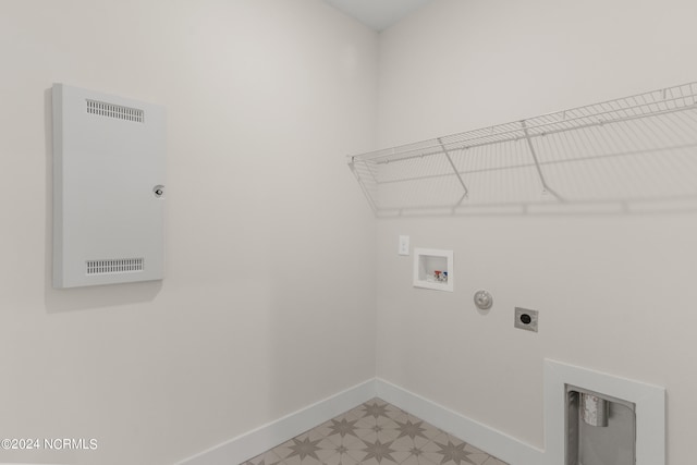 clothes washing area featuring hookup for a washing machine, gas dryer hookup, and hookup for an electric dryer