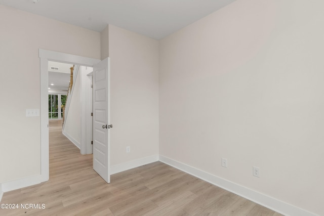 spare room with light hardwood / wood-style floors