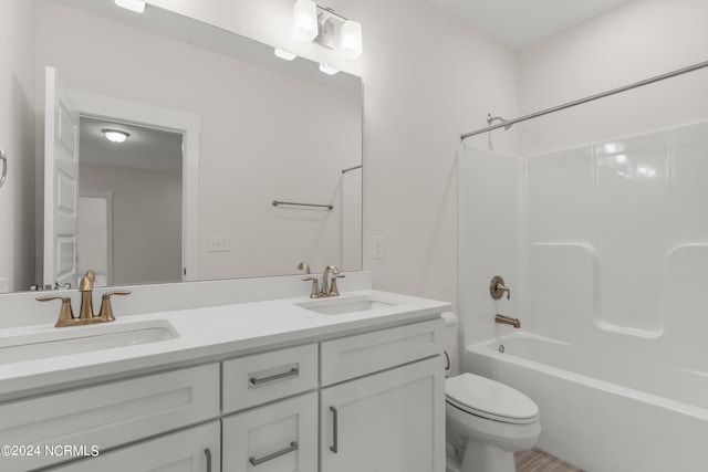 full bathroom with shower / tub combination, vanity, and toilet