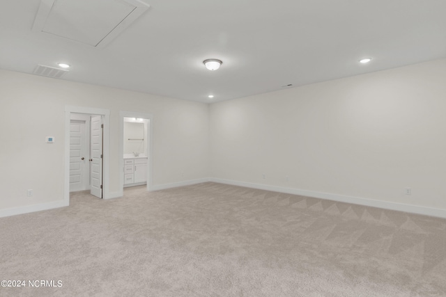 empty room with light colored carpet