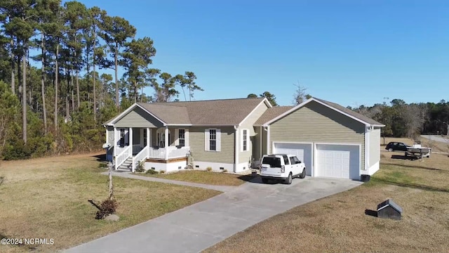 view of front of house with a front lawn, a porch, and a garage