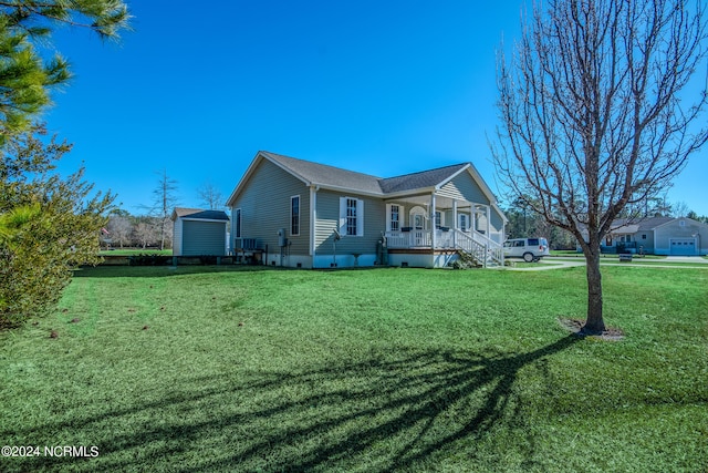 view of property exterior with a yard and covered porch