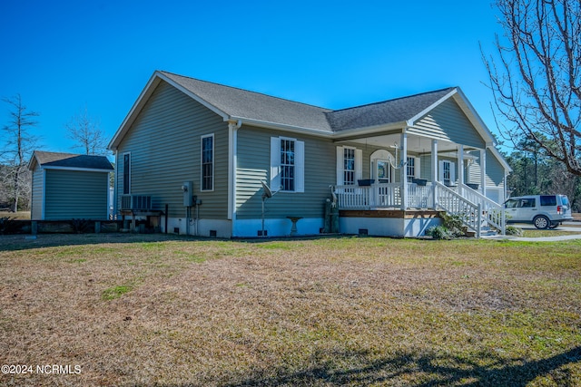 view of front facade with covered porch and a front lawn