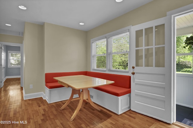 dining area with breakfast area, wood finished floors, healthy amount of natural light, and recessed lighting