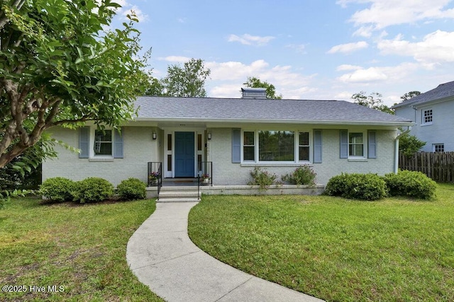 single story home featuring brick siding and a shingled roof