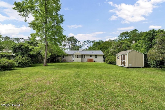 view of grassy yard with a shed and an outdoor structure
