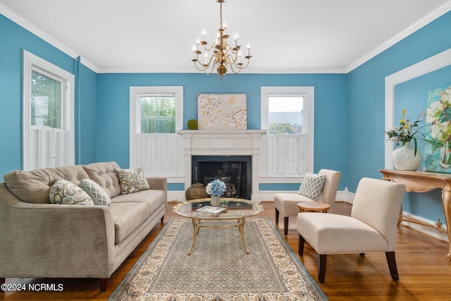 living room featuring a notable chandelier, hardwood / wood-style floors, and crown molding