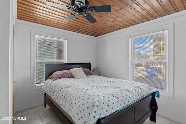 tiled bedroom with wooden ceiling, ceiling fan, crown molding, and multiple windows