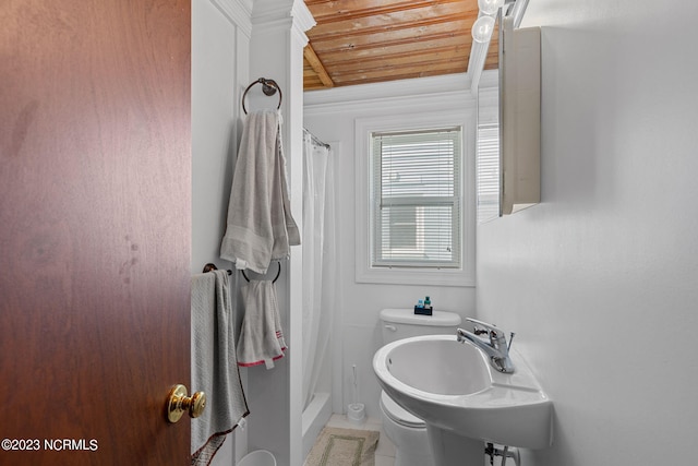 bathroom featuring toilet, wood ceiling, walk in shower, tile floors, and sink