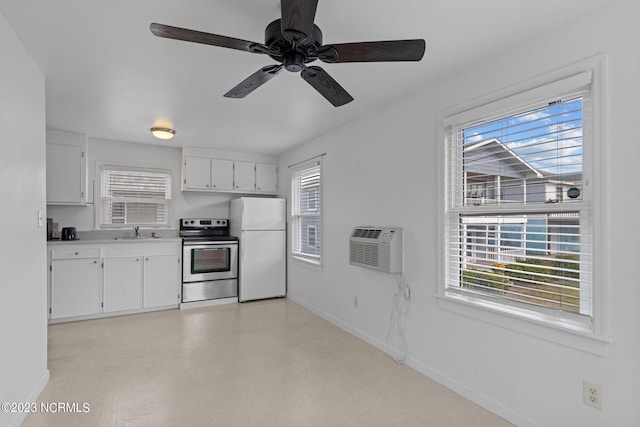 kitchen with white refrigerator, ceiling fan, electric range, white cabinets, and sink