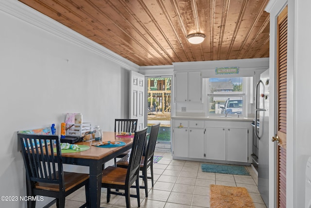 tiled dining room featuring wood ceiling and crown molding