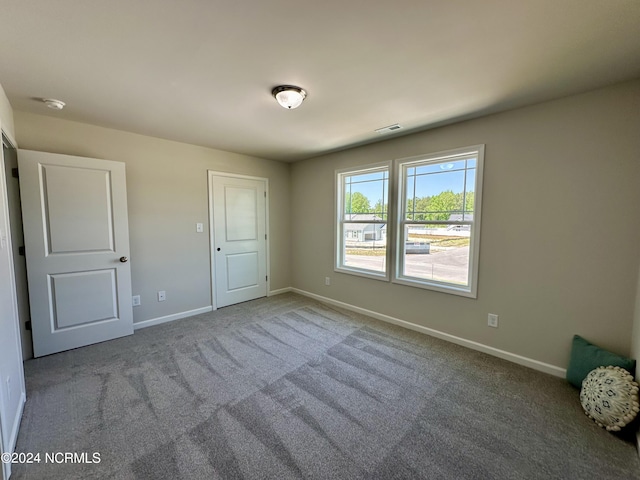 unfurnished bedroom featuring carpet