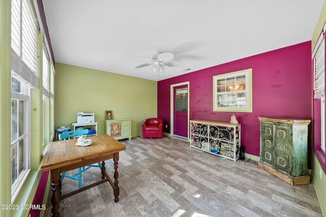 office space with ceiling fan, a wealth of natural light, and light wood-type flooring