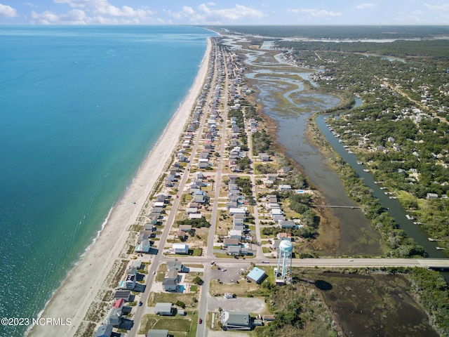 bird's eye view with a water view and a view of the beach