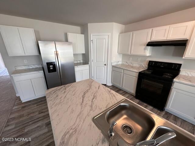 kitchen featuring white cabinetry, electric range, stainless steel fridge with ice dispenser, light stone counters, and dark hardwood / wood-style flooring