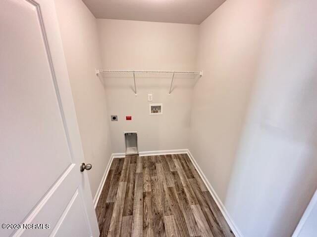 washroom featuring dark hardwood / wood-style flooring, electric dryer hookup, and hookup for a washing machine