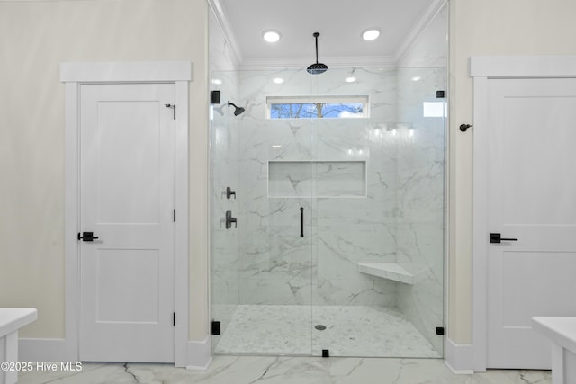 full bathroom featuring marble finish floor, a marble finish shower, and crown molding