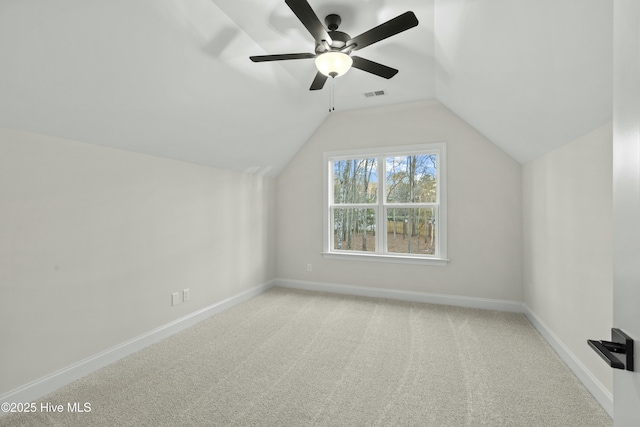 bonus room with baseboards, visible vents, ceiling fan, vaulted ceiling, and carpet floors