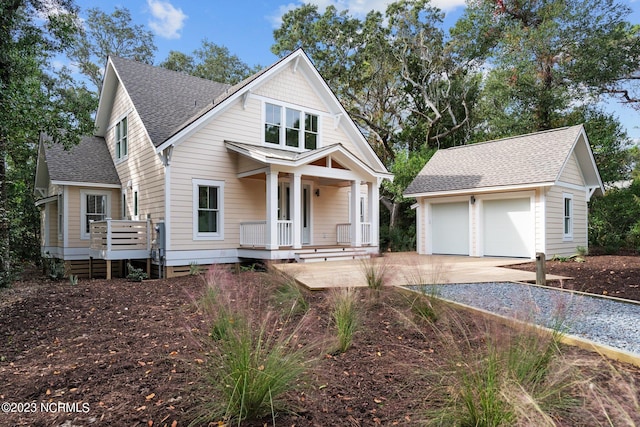 view of front of house with a porch and a garage