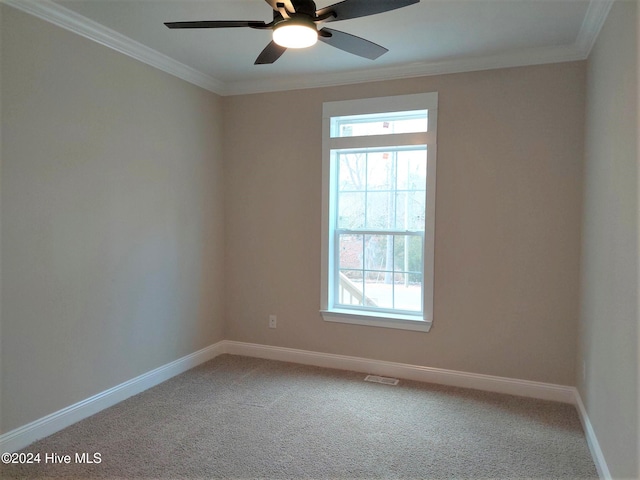 unfurnished room featuring carpet flooring, crown molding, and ceiling fan