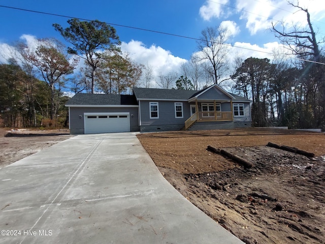 view of front of house with covered porch and a garage