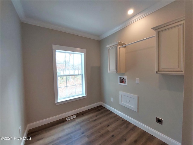 clothes washing area with cabinet space, baseboards, crown molding, washer hookup, and electric dryer hookup