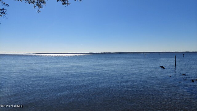 surrounding community featuring a water view