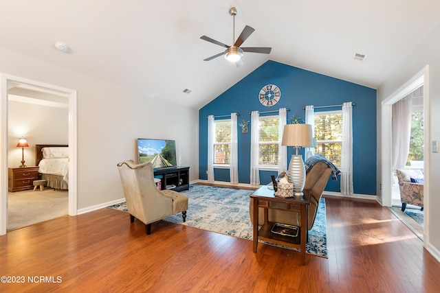 living room featuring carpet floors, ceiling fan, and high vaulted ceiling