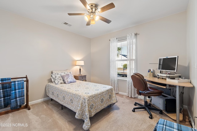 bedroom with light carpet and ceiling fan