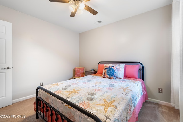 bedroom featuring light carpet and ceiling fan