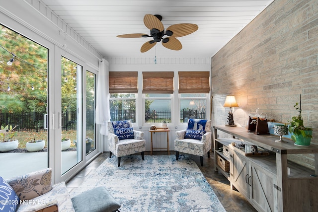 sunroom / solarium with ceiling fan