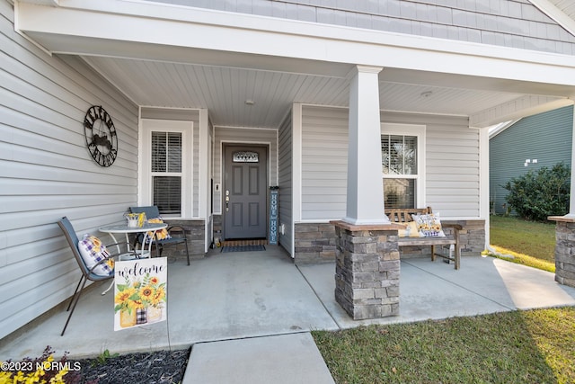 doorway to property featuring a porch