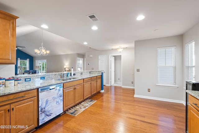 kitchen featuring sink, dishwasher, light hardwood / wood-style flooring, and a healthy amount of sunlight