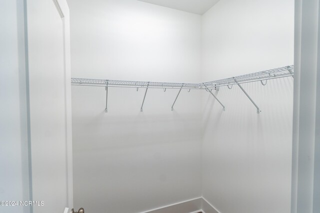 laundry area featuring hookup for an electric dryer, hardwood / wood-style flooring, gas dryer hookup, and washer hookup