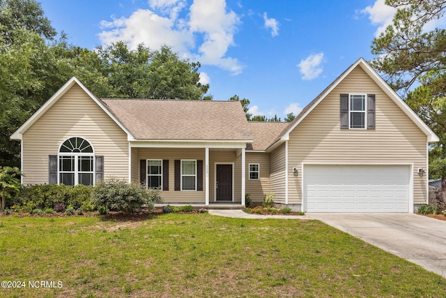 front facade featuring a garage and a front yard