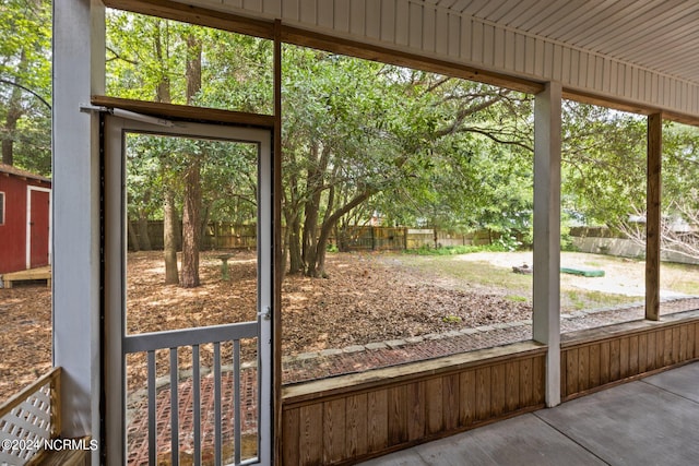 unfurnished sunroom with a wealth of natural light