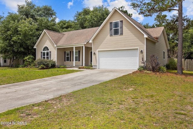 view of front of property featuring a garage and a front lawn