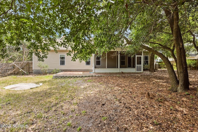 back of property featuring a sunroom