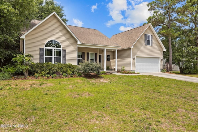 view of front of property with a garage and a front yard