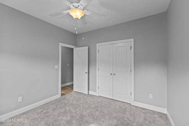 unfurnished bedroom with a closet, ceiling fan, and carpet