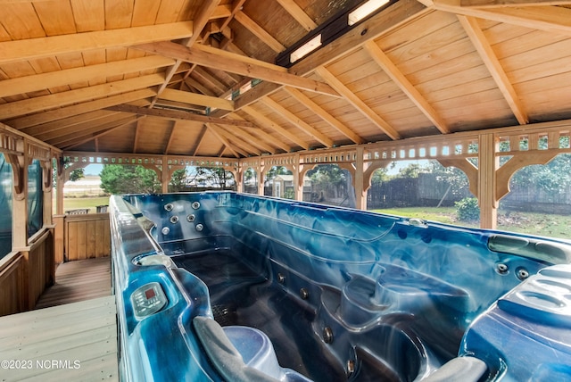 exterior space with a gazebo and a hot tub