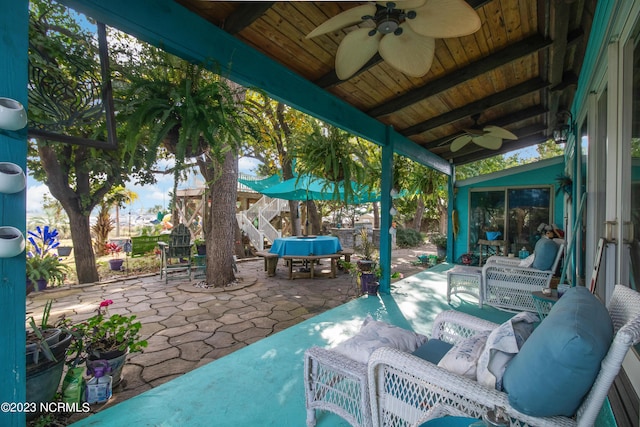 view of patio featuring an outdoor hangout area and a ceiling fan