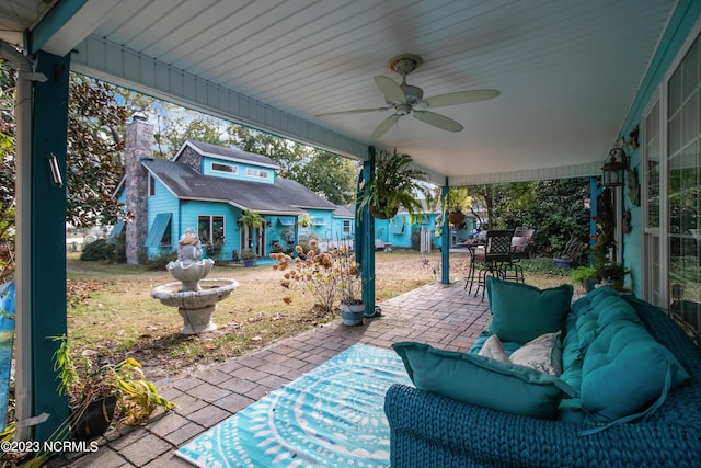 view of patio / terrace featuring outdoor dining area and a ceiling fan