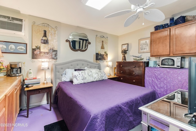 bedroom featuring an AC wall unit and ceiling fan