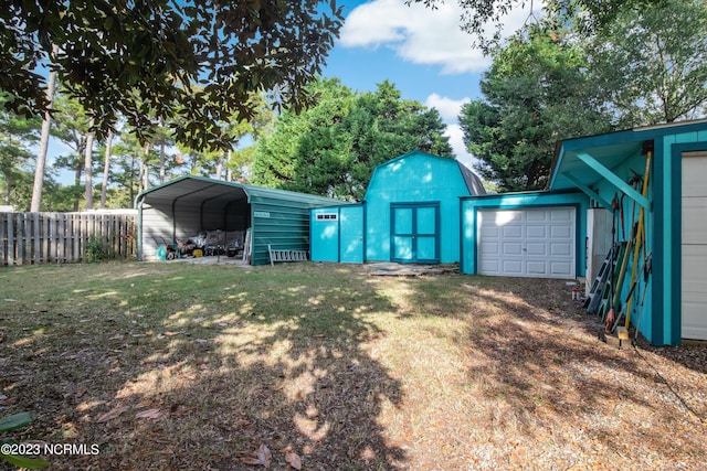 view of yard with fence and driveway