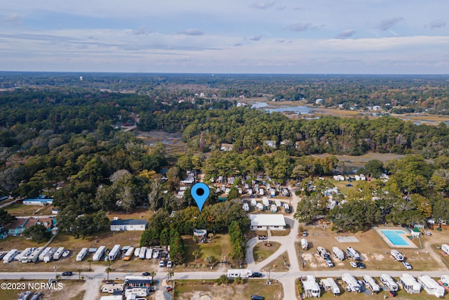 drone / aerial view featuring a forest view