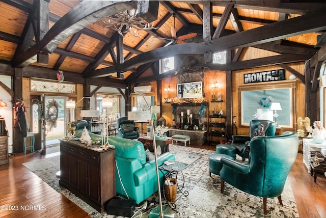 living area with wood walls, wood ceiling, lofted ceiling with beams, a wall mounted AC, and wood-type flooring